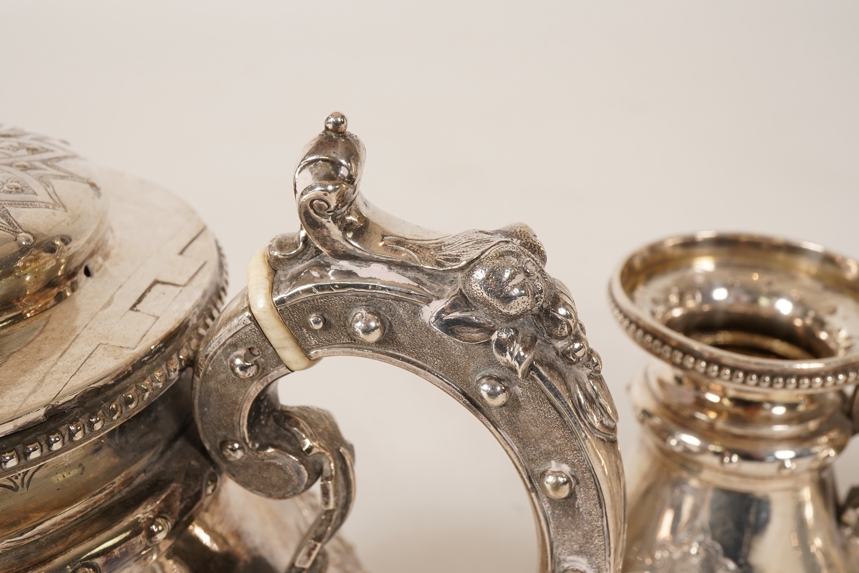 A Victorian ornate silver four piece tea and coffee service, by Thomas Smily